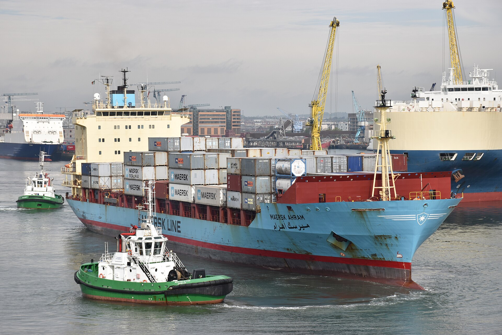 Container ship Maersk Ahram leaving Dublin with a tug at her bow