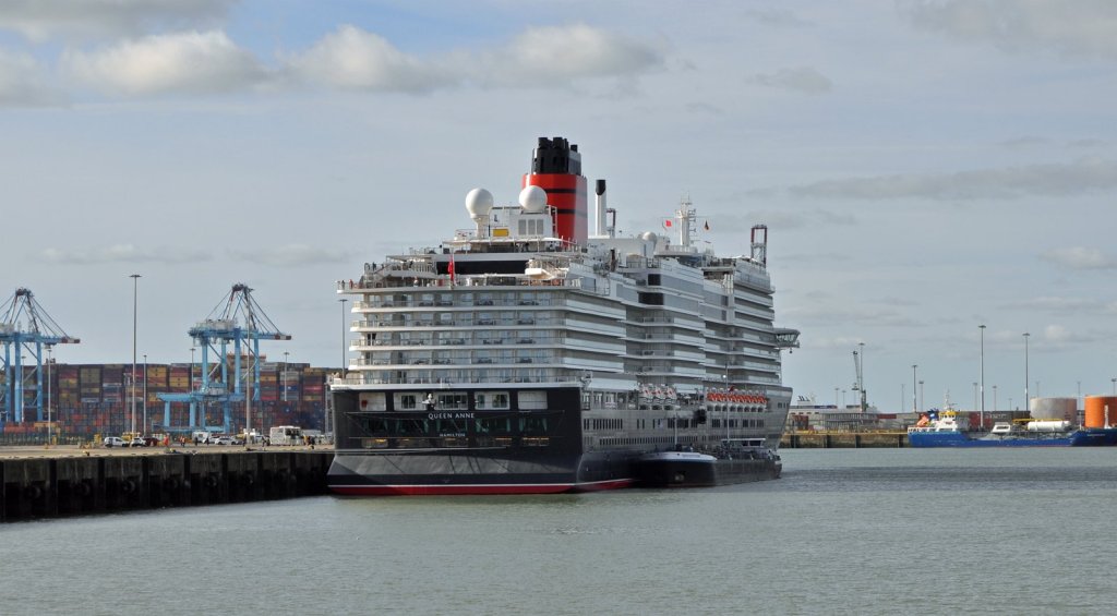Queen Anne berthed at Zeebrugge, viewed from the stern with her name and Cunard funnel visible.